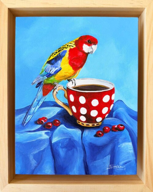 "Rosella's Roast" an original acrylic painting of an Eastern Rosella perched on a polka-dot teacup, from Jess King's Found and Collected series.