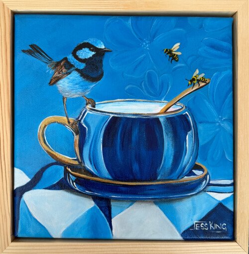 "A Little Sweet Company" is an original oil painting from Jess King's Found & Collected series, featuring a superb fairywren perched on the gilded rim of a vintage blue and gold teacup, as two honeybees hover nearby