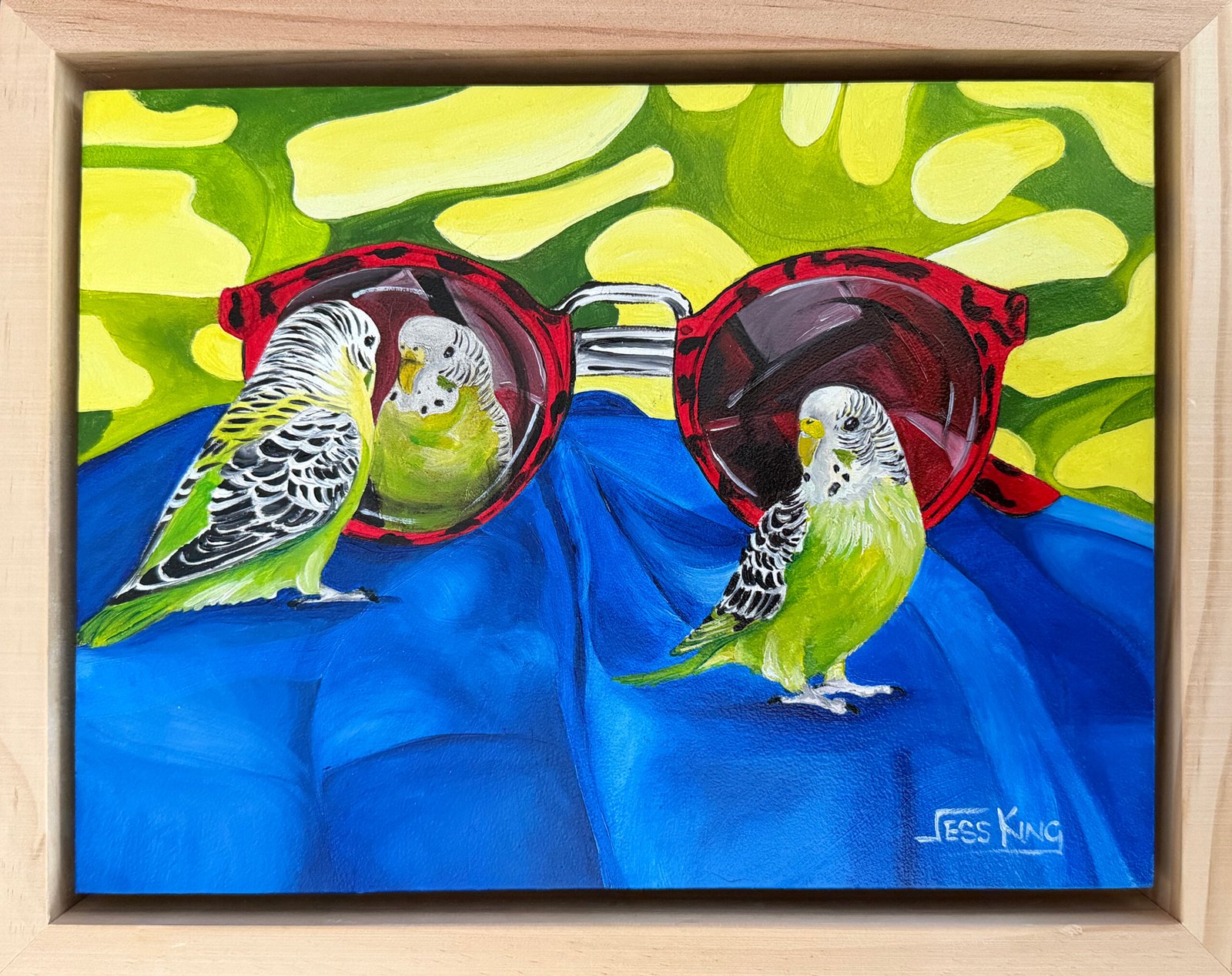 What a Pretty Boy" is an original oil painting by Australian artist Jess King, depicting two budgerigars with a pair of red tortoiseshell vintage sunglasses against a bold green leaf background.